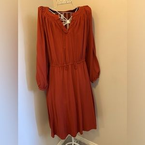 Rust colour casual dress. Boho with tassle tie neckline and elastic waist